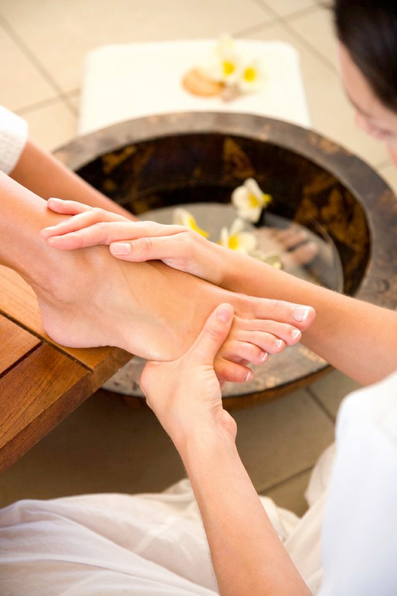 Foot reflexology treatment at a professional wellness spa in Thrissur, Kerala