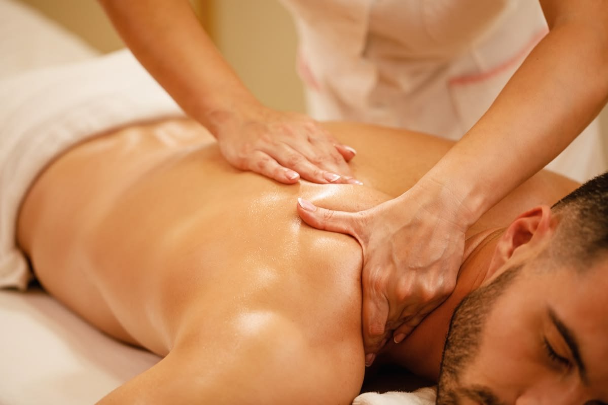Deep tissue massage treatment at a professional spa in Thrissur, Kerala