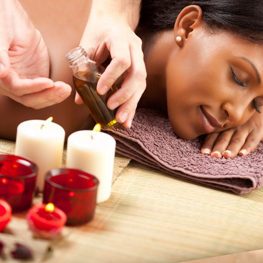 Aromatherapy massage with aromatic oils at a spa in Thrissur, Kerala